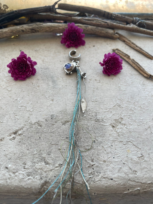 EARRING 95: STERLING SILVER CUFF WITH HALLOW FORM HEART AND KYANITE. BLUE STRING AND LEAF